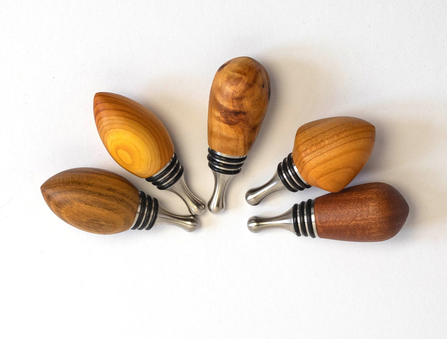 bottle stoppers made of various woods